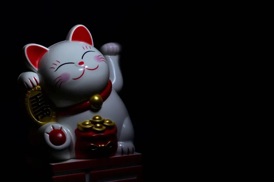 Hình nền mèo thần tài vẫy tay dễ thương
